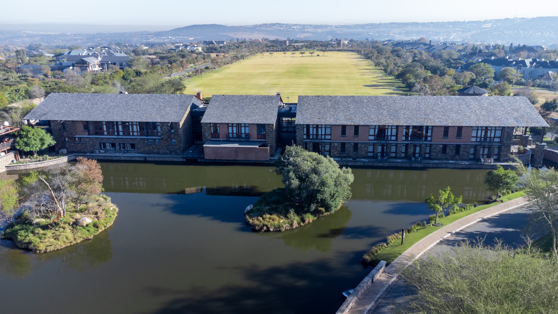 Aerial view of Riboville beside the lake and polo fields